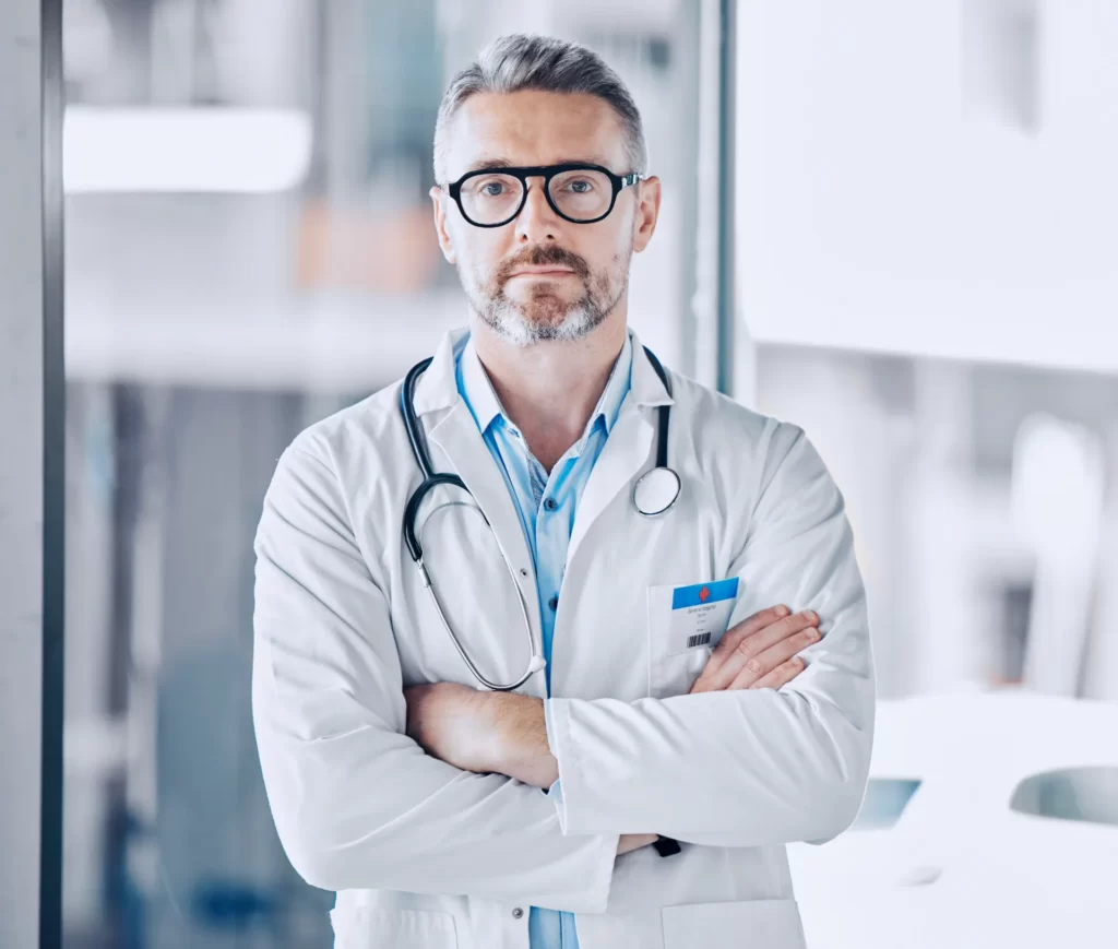 mature doctor man arms crossed and portrait for l utc